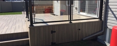 Wood deck with tempered glass surround